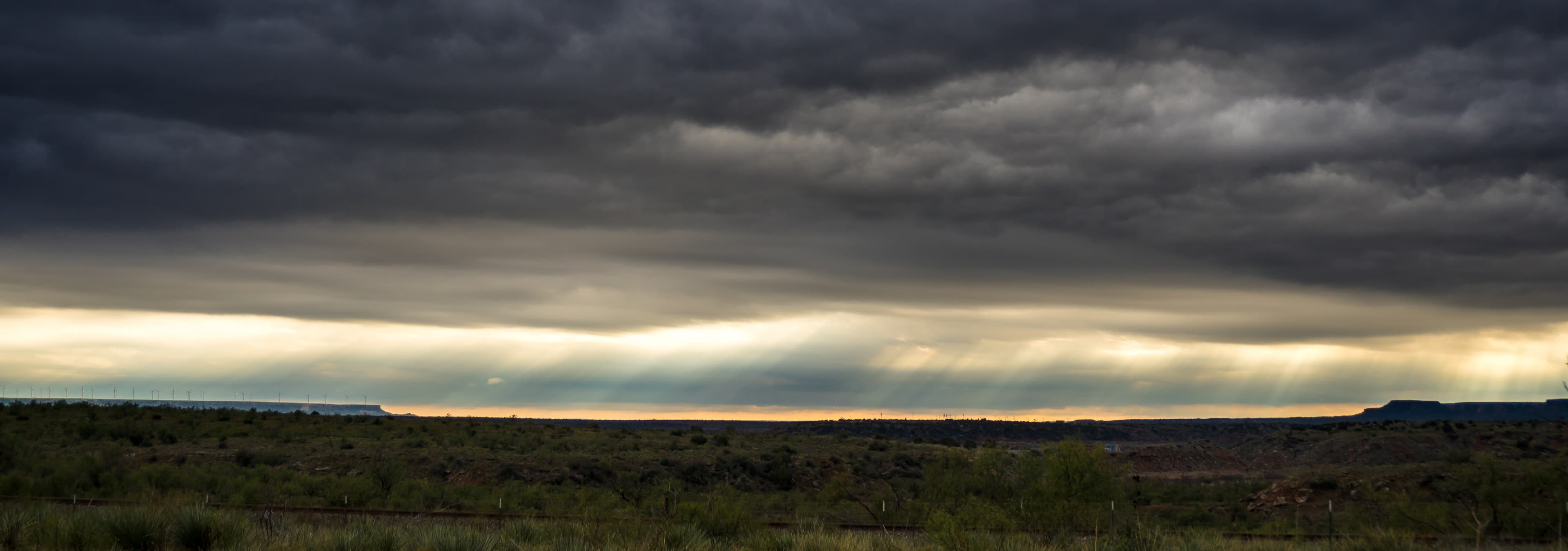 Storm clouds hang low over wide plains near Lubbock, Texas